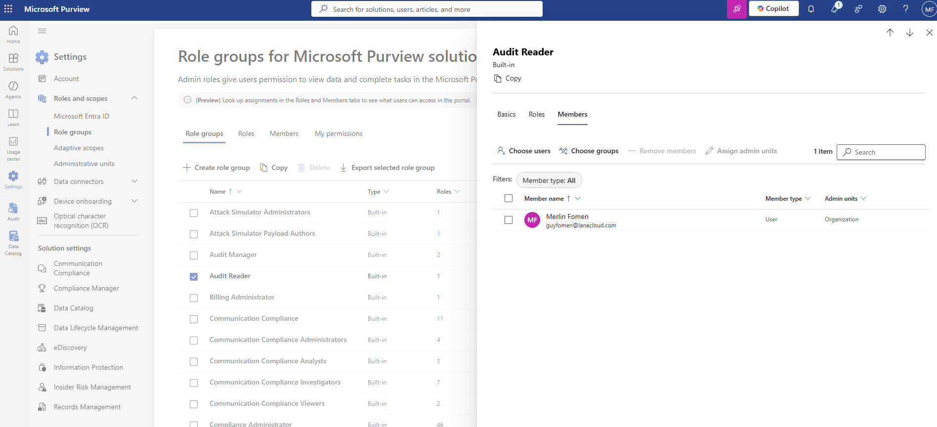 Microsoft Purview Role groups — Audit Reader selected, Members tab showing Merlin Fomen (guyfomen@lanacloud.com, User, Organization)
